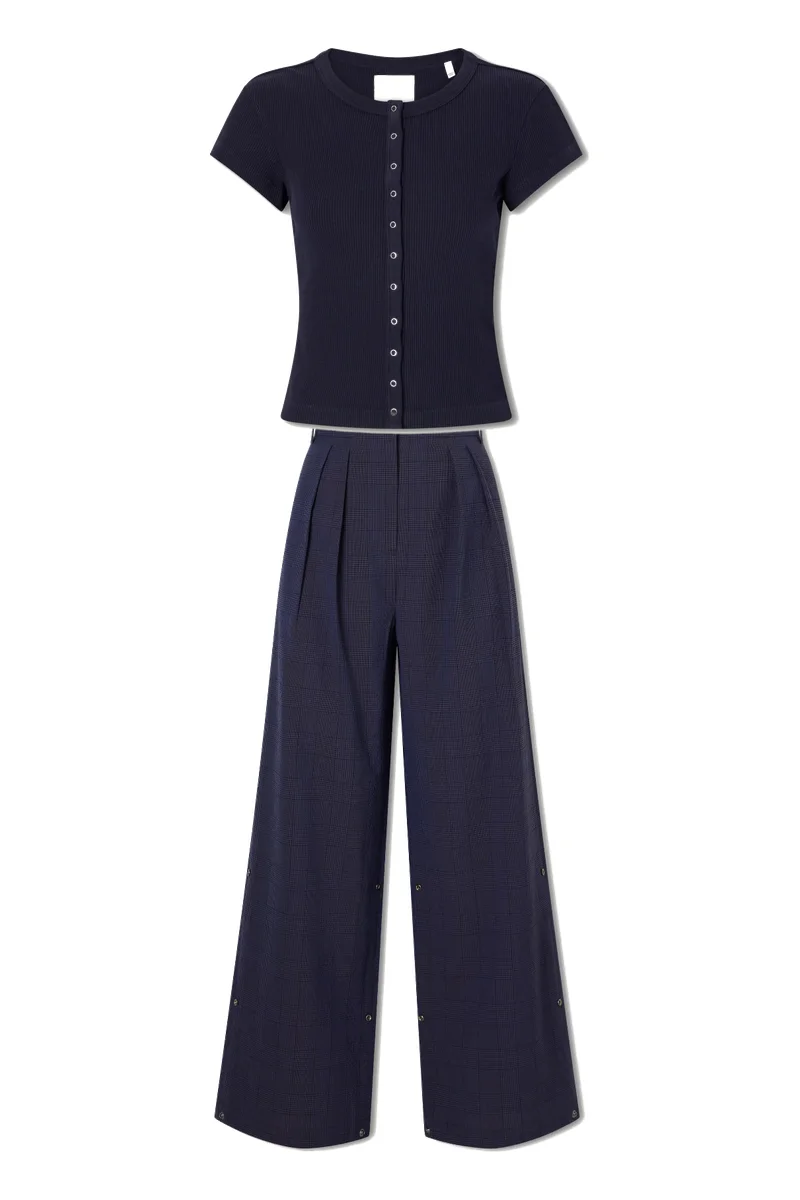 Flat product photos of a navy top and trousers as uploaded